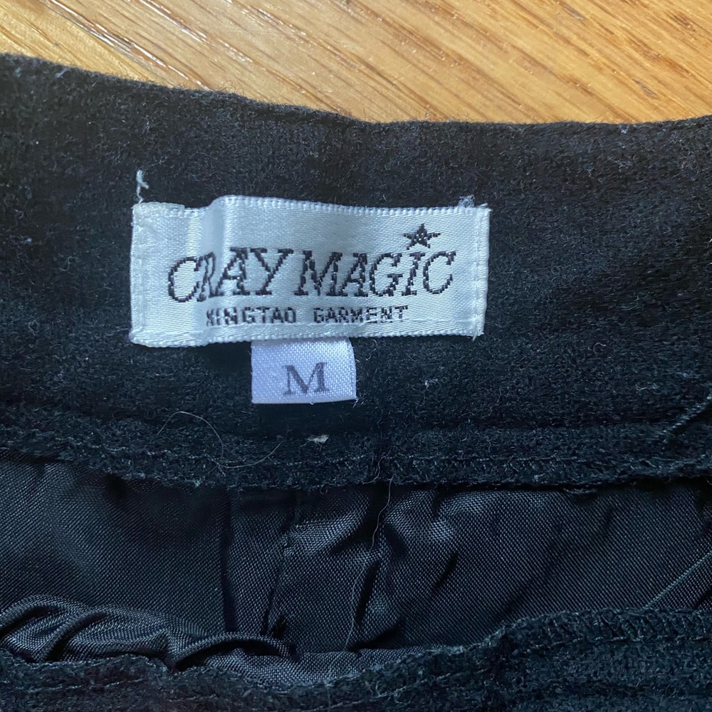 Classic « carrot » style - wool black pants
